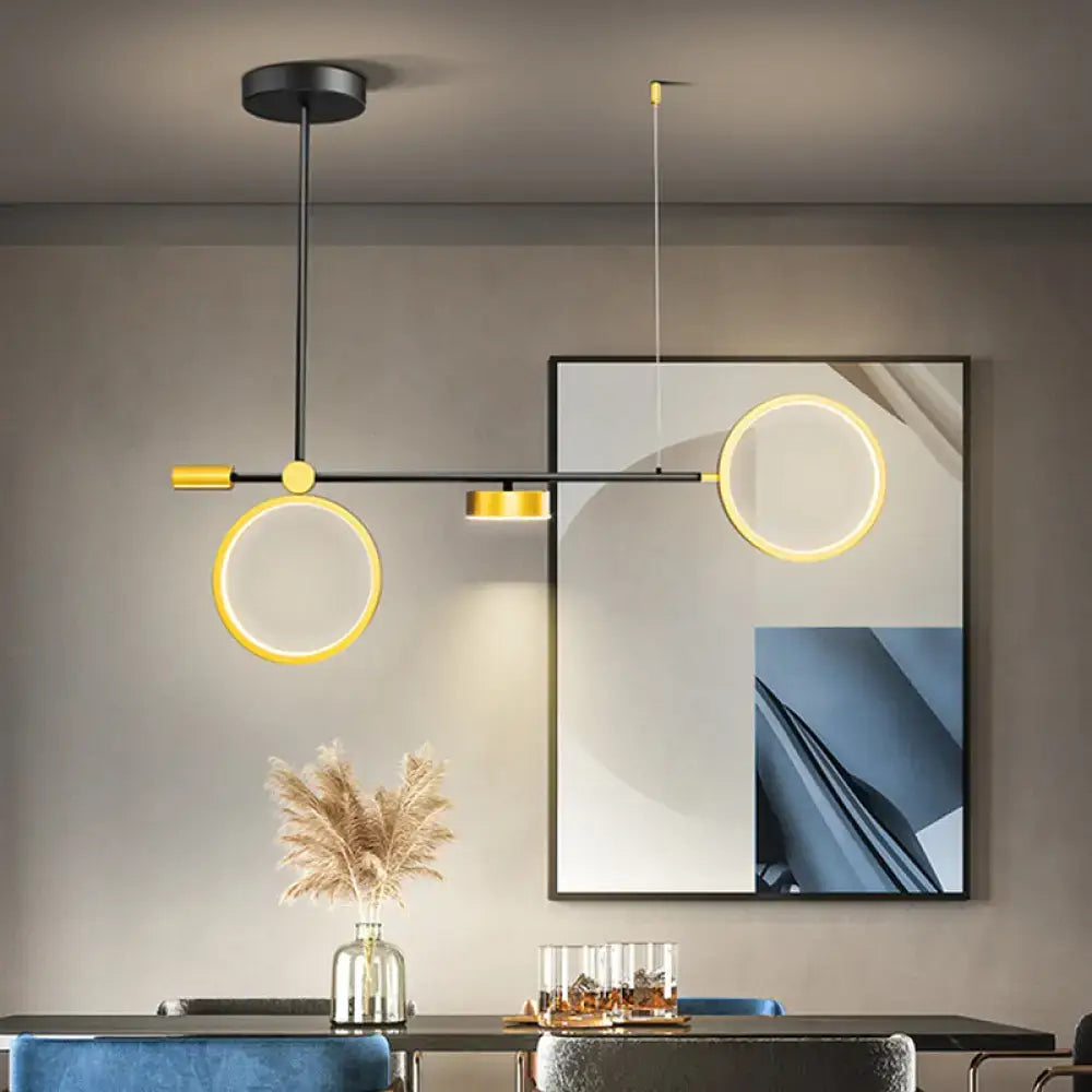 Modern black and gold metal pendant light with illuminated circular rings featuring warm white 220v-240v 110v-120v illumination