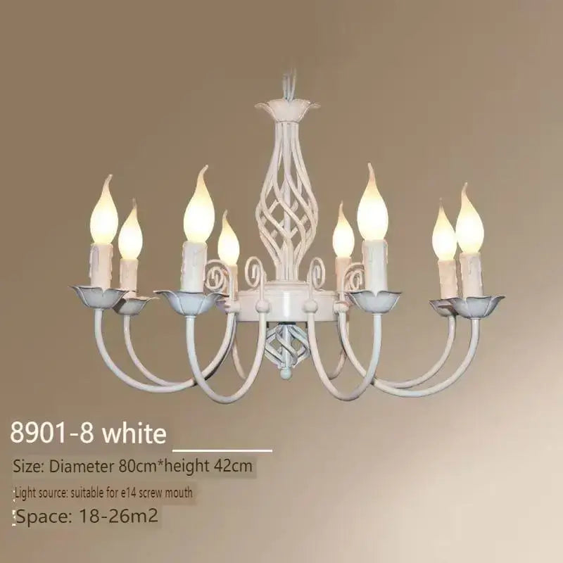 White wrought iron chandelier with eight candle-style bulbs and ornate twisted design for living room lighting