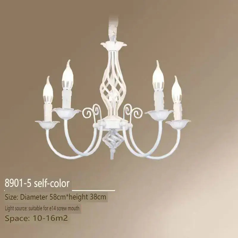 White ornate chandelier with five candle-style bulbs and scrolled metal arms in modern black iron for living room