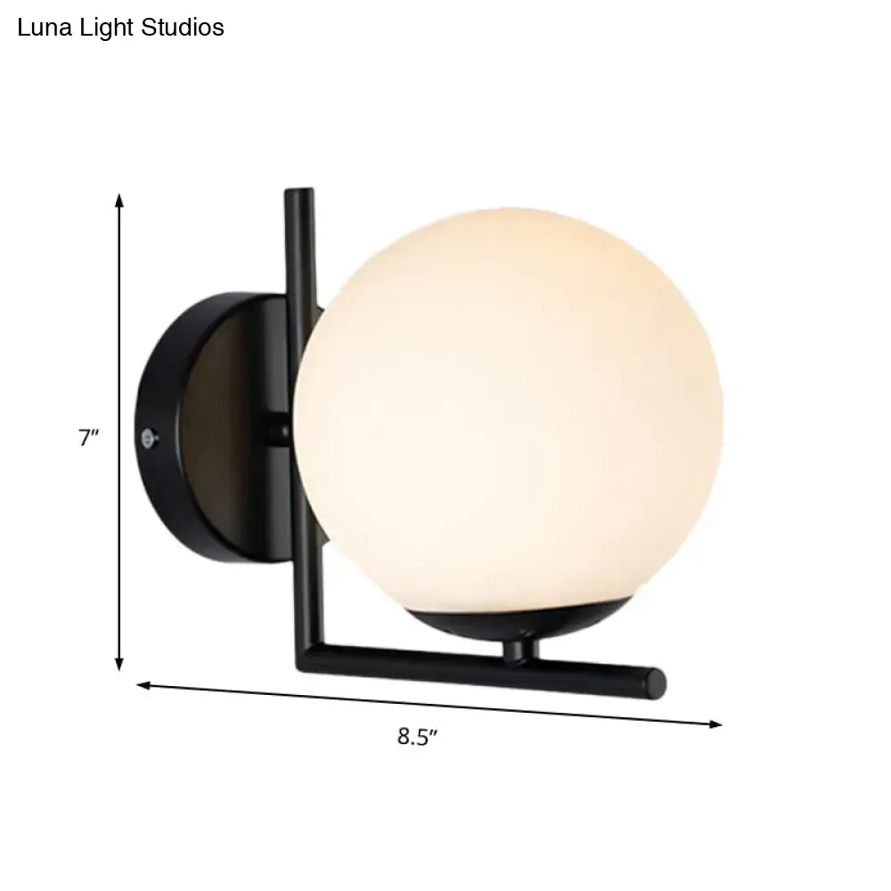 Modern black metal wall sconce with frosted black opal glass globe for bedroom light fixture use