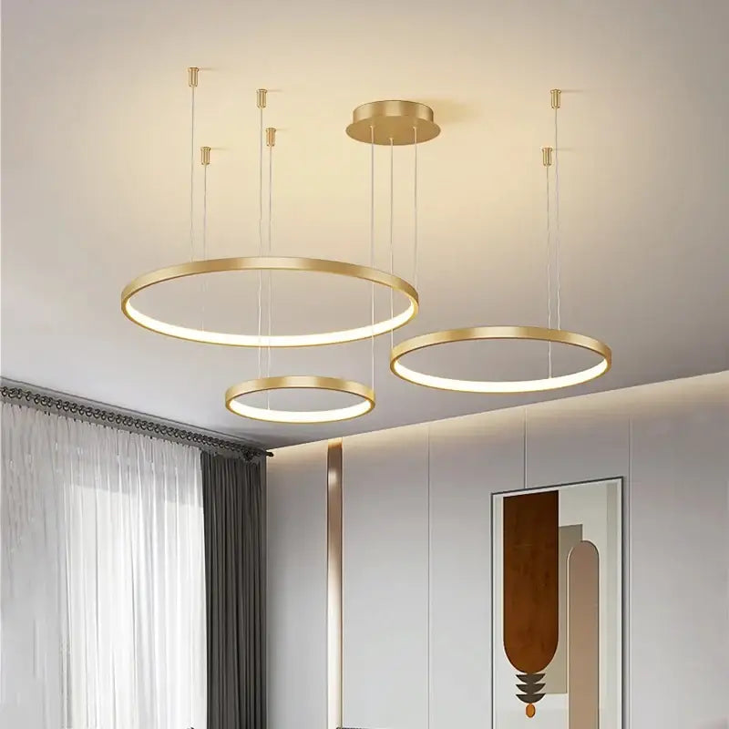 Decorbites™ modern black pendant light with gold-toned circular illuminated rings for living room lighting