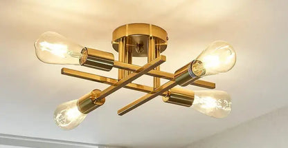 Decorbites™ modern black sputnik chandelier flush mount with gold-toned fixture and four exposed filament bulbs in geometric design