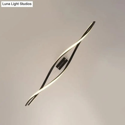 Modern minimalist black twist led pendant light with intertwined aluminum arms and central black fixture for restaurants