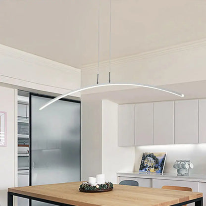 Modern white curved DecorBites pendant light with black white arch acrylic LED and warm white glow above wooden table