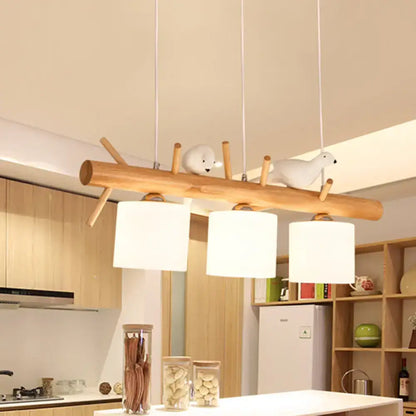 DecorBites modern wooden branch island pendant light with three cream glass shades and two white bird figurines for dining room