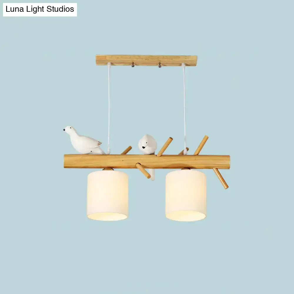 DecorBites modern branch island pendant light with wood frame, ceramic birds, and cream glass shade for dining room