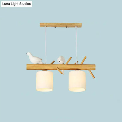 DecorBites modern branch island pendant light with wood frame, ceramic birds, and cream glass shade for dining room