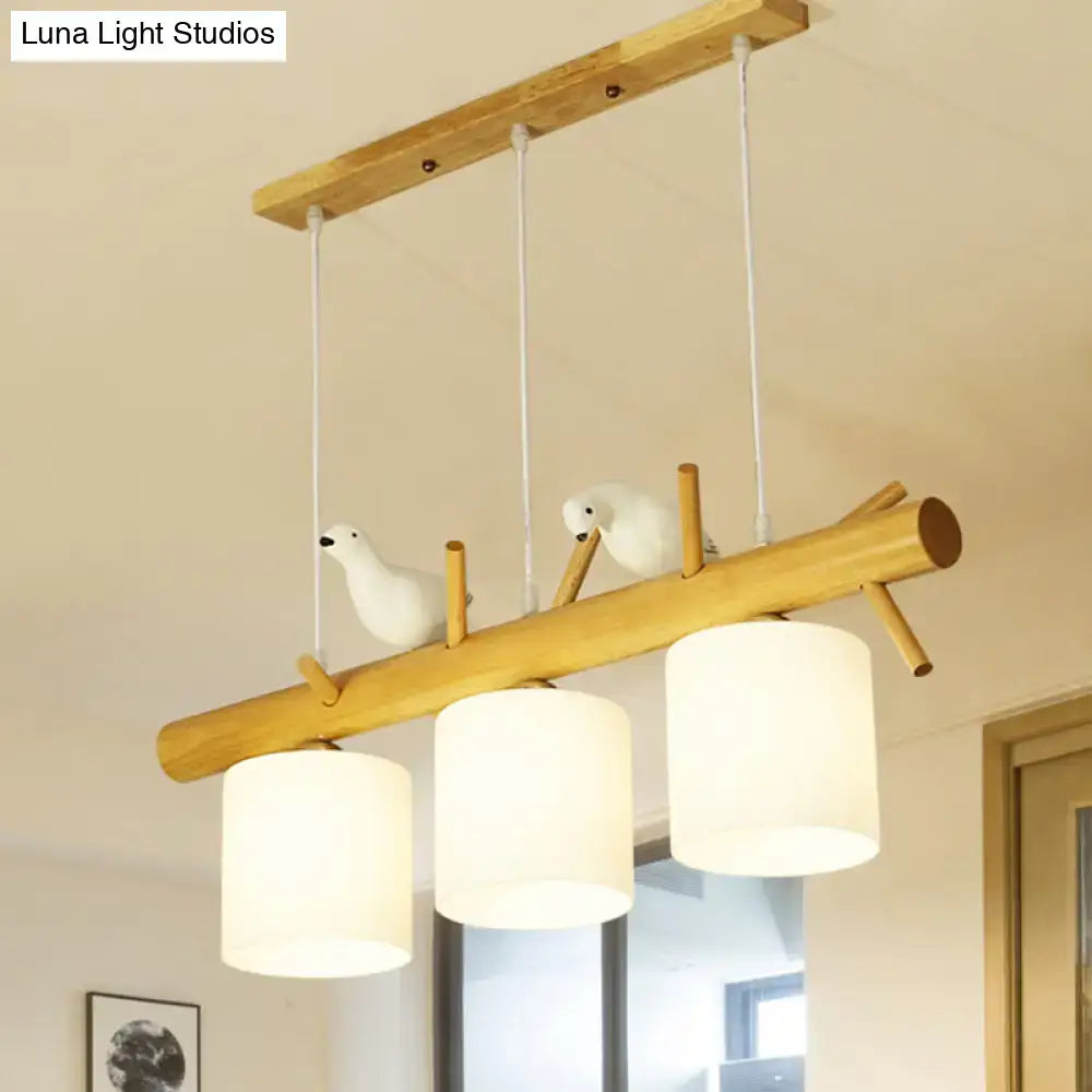DecorBites modern branch island pendant light with wooden frame, cream glass shade, and bird figurines for dining room