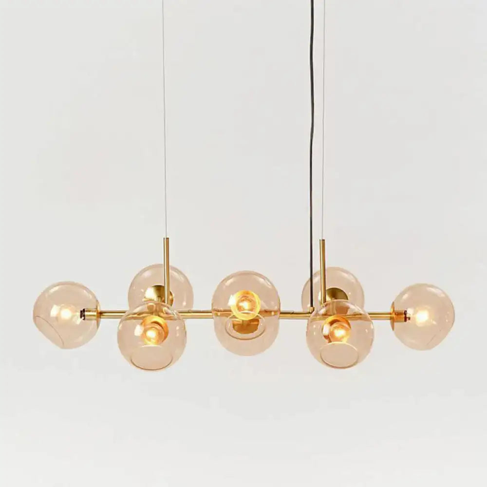 Decorbites modern brass bar pendant light with six amber glass globes for elegant dining room suspension lighting
