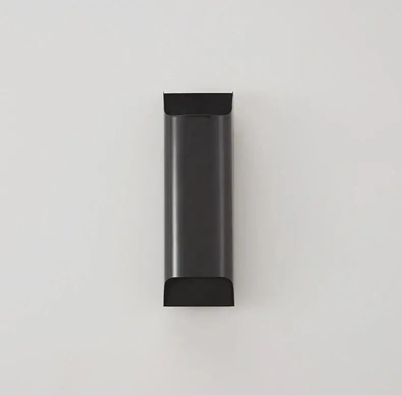 Black cylindrical wall lamp with sleek minimalist design from decorbites modern brass led collection
