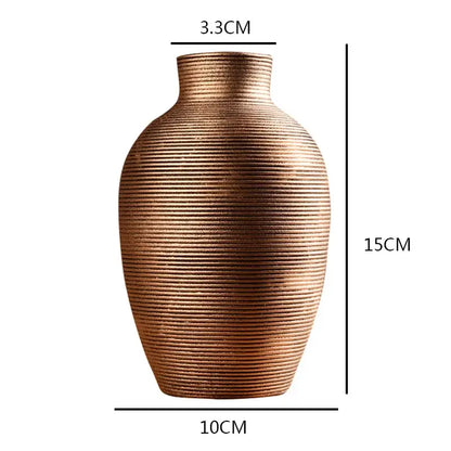Bronze-colored ribbed ceramic vase with rounded body for modern home decor from decorbites ceramic nordic collection