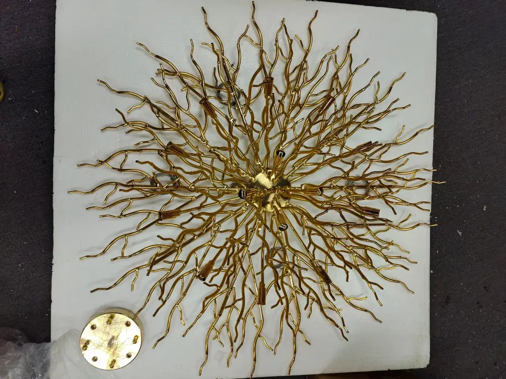 Golden intricate metal crystal chandelier with branching arms central hub for living room lamp package by decorbites