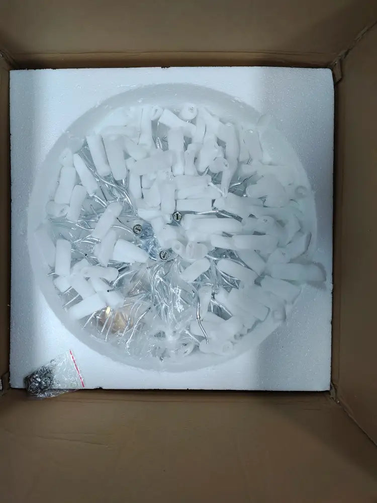 White plastic and metal components arranged circularly for decorbites modern chrome crystal chandelier lamp package