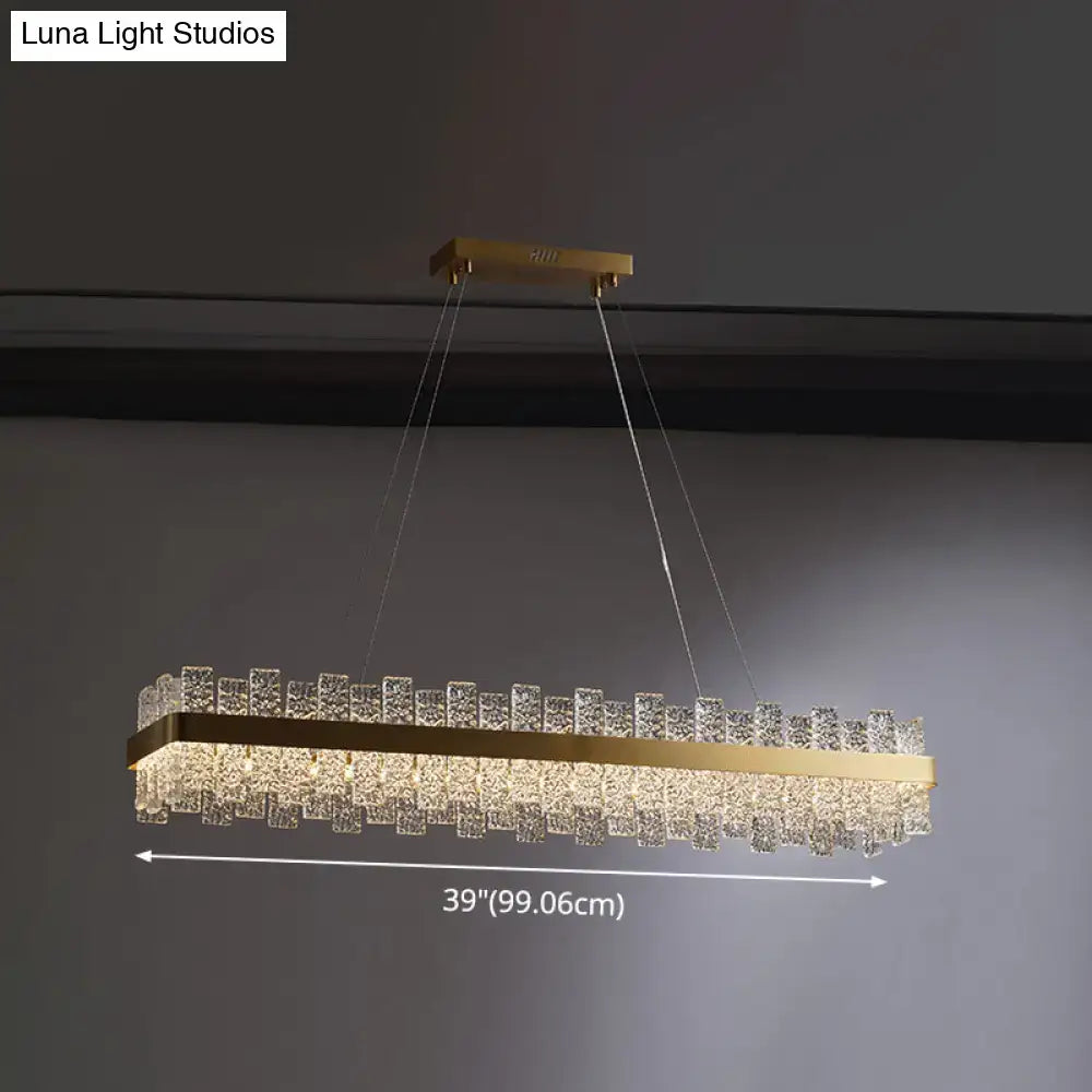 Gold-toned brass plated decorbites modern crystal loop pendant light with cascading clear crystal prisms and led