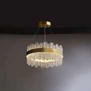 Gold-toned brass plated DecorBites™ pendant light with crystal loop design and cascading textured glass pieces