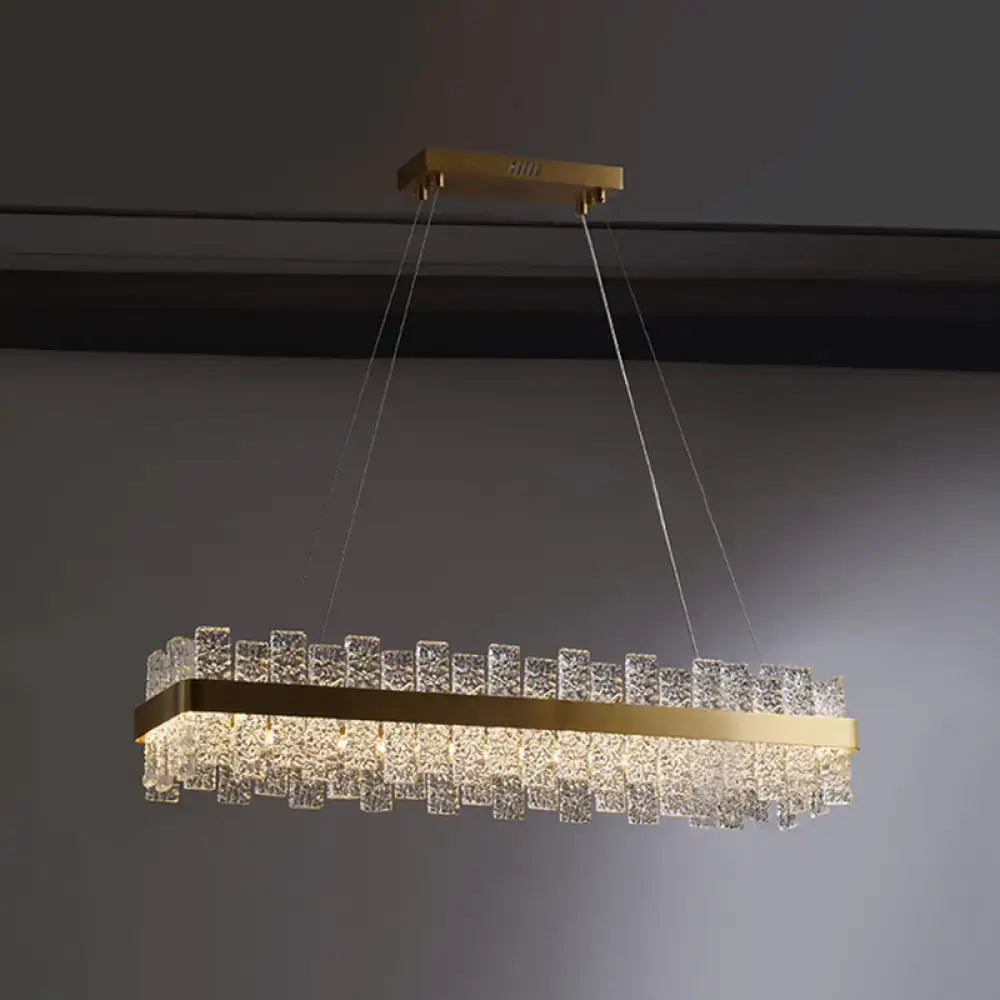 DecorBites™ modern crystal loop pendant light with brass plated finish features cascading clear crystals and LED illumination
