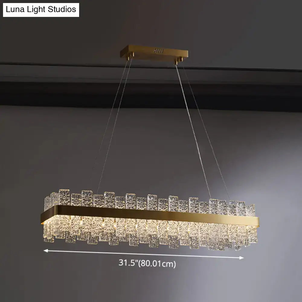 Decorbites™ modern crystal loop pendant light with brass plated finish and cascading clear crystal cubes