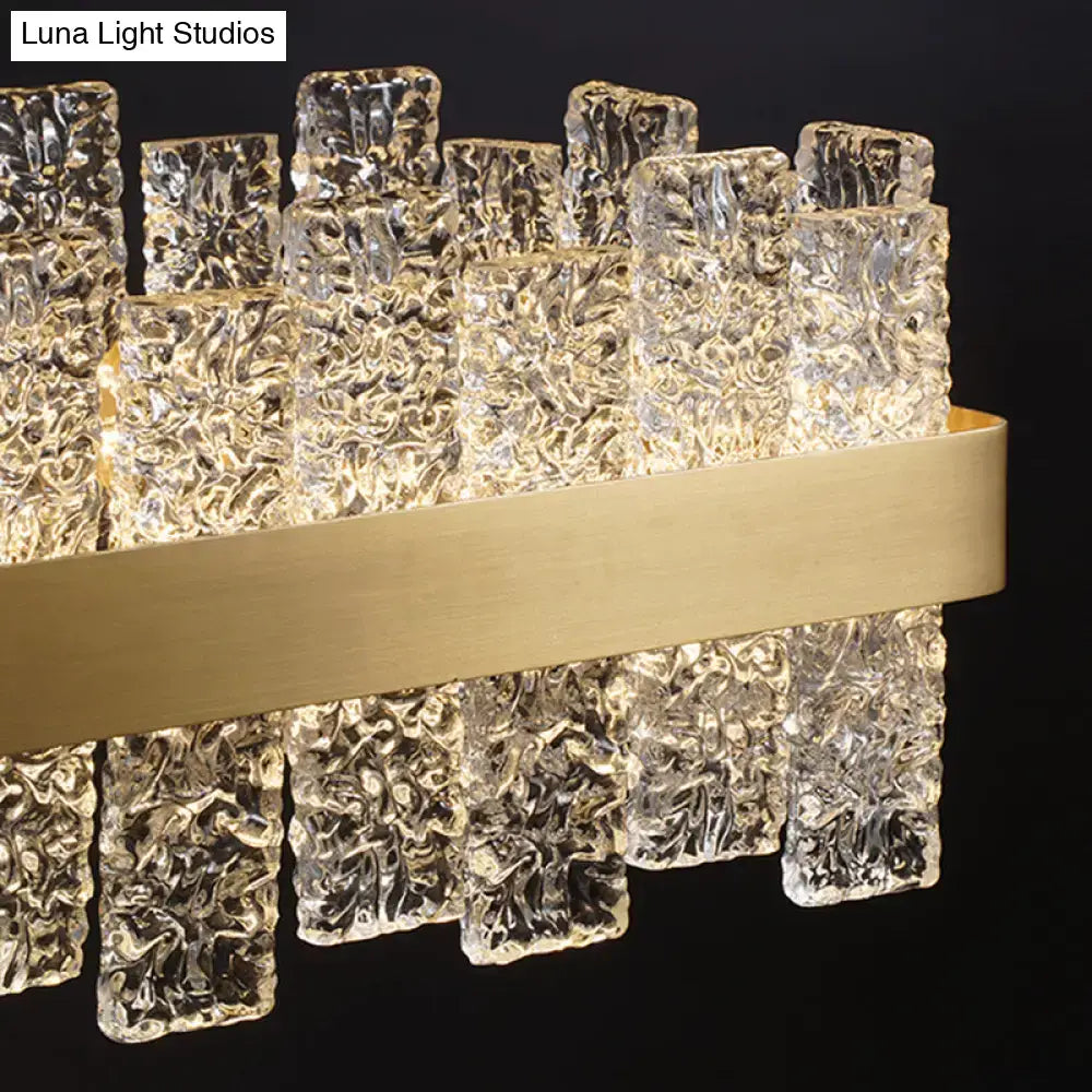 Decorbites™ modern crystal loop pendant light with clear textured glass blocks and brass plated metal band