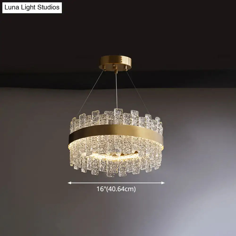 Decorbites modern crystal loop pendant light with brass plated finish and cascading clear crystal pieces