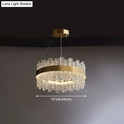 Decorbites modern crystal loop pendant light with brass plated finish and cascading clear crystal pieces