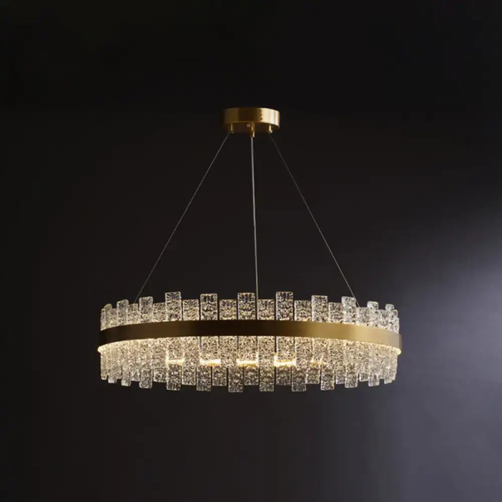 Decorbites™ modern crystal loop pendant light with brass plated finish and cascading clear crystal blocks in concentric rings