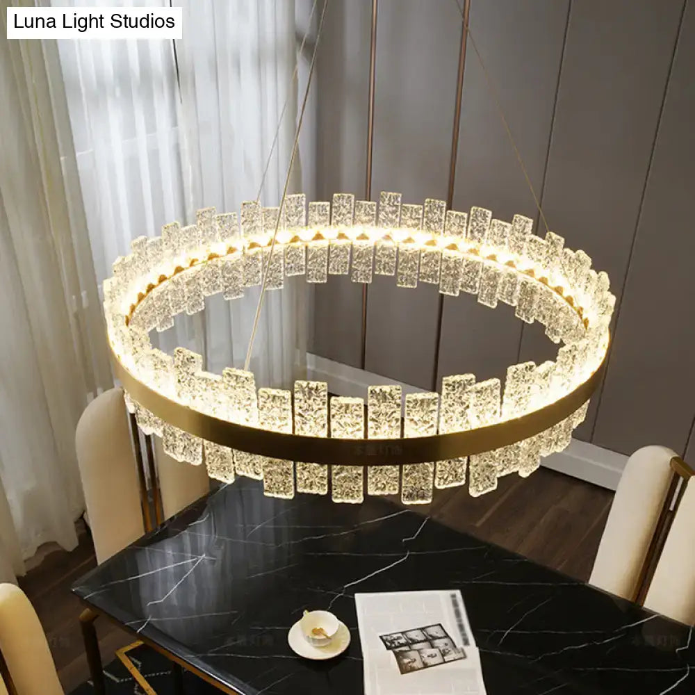 DecorBites™ modern crystal loop pendant light with brass plated finish and faceted crystals in concentric rings