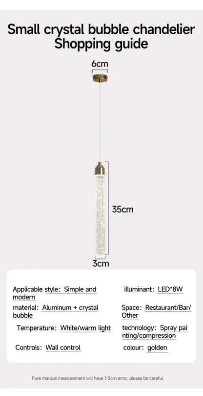 DecorBites modern crystal pendant light with gold fixtures features a clear cylindrical body filled with sparkling bubbles