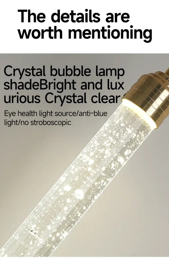 Decorbites™ modern crystal pendant light with gold fixtures featuring a clear glass shade filled with sparkling bubbles