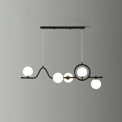 Modern black metal curve island ceiling light with five frosted glass globe bulbs for dining room illumination