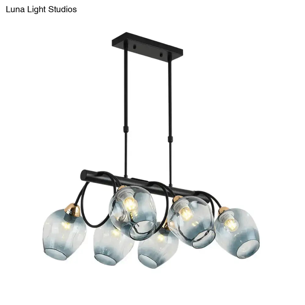 DecorBites modern black metal island light with five frosted blue glass globes and brass accents wine cup island light