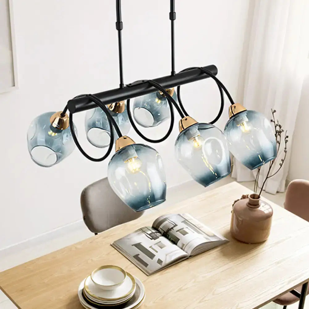 Decorbites modern dimpled glass wine cup island light with five blue gradient glass shades and gold fixtures suspended