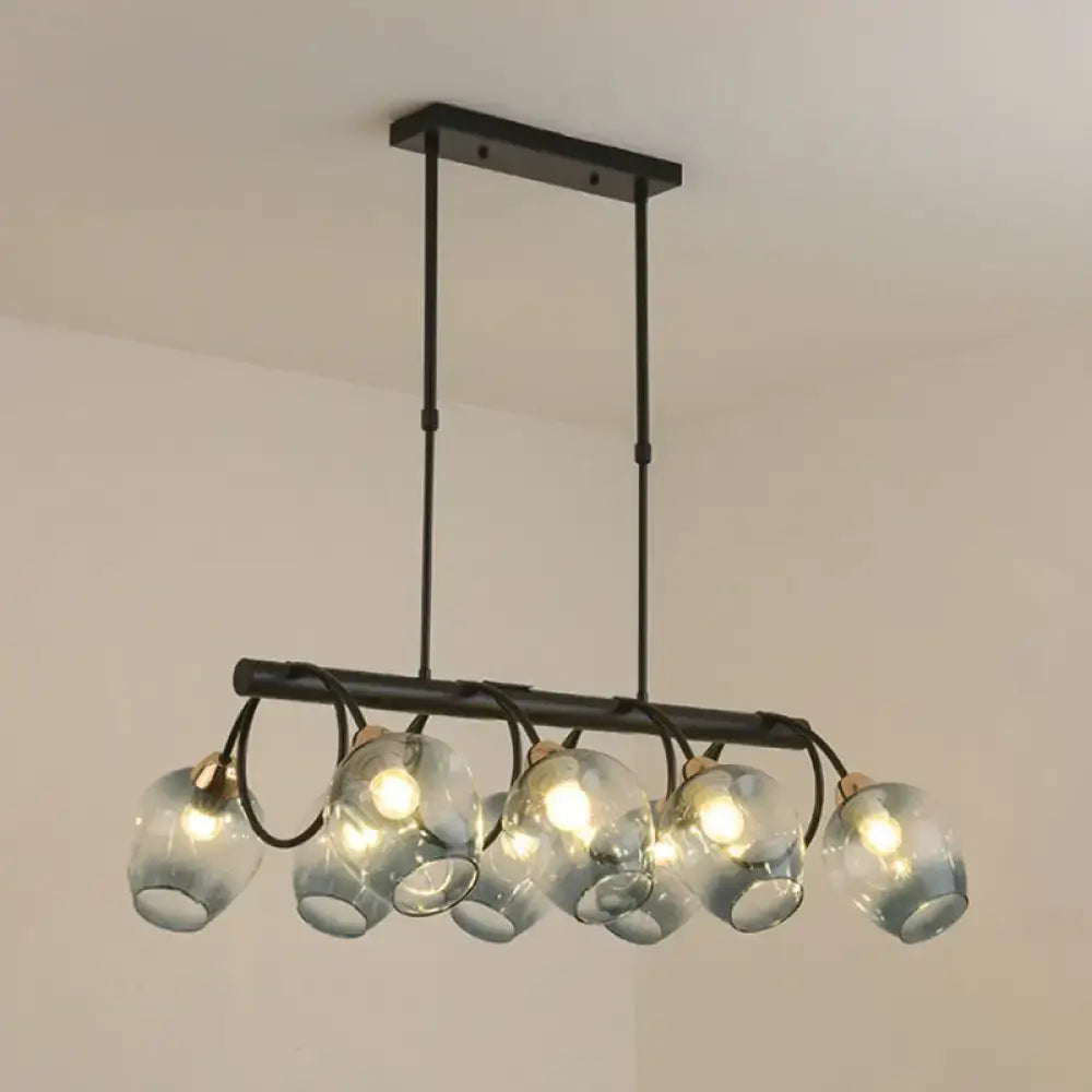 Modern black metal wine cup island light with six translucent blue glass globe shades by DecorBites™