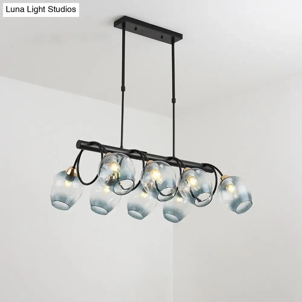 Modern black metal chandelier with five translucent blue glass globe shades for a DecorBites wine cup island light