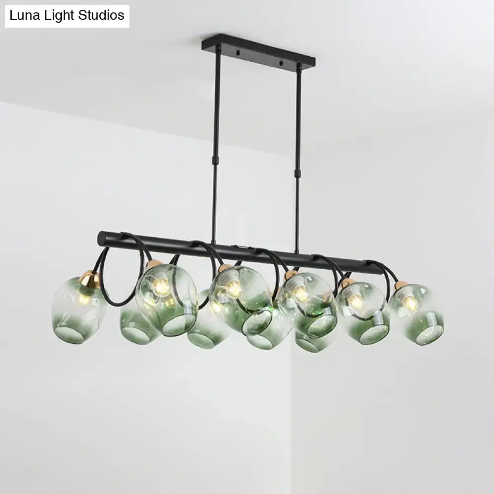 Modern black metal island light featuring six translucent green ombre dimpled glass globes for wine cup island use