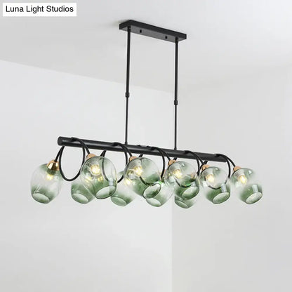Modern black metal island light featuring six translucent green ombre dimpled glass globes for wine cup island use