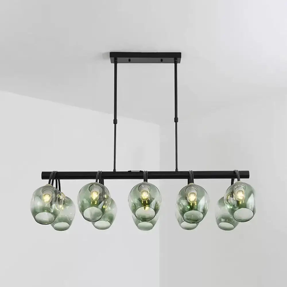 Modern black metal DecorBites island light with six translucent green dimpled glass wine cup shades suspended fixture
