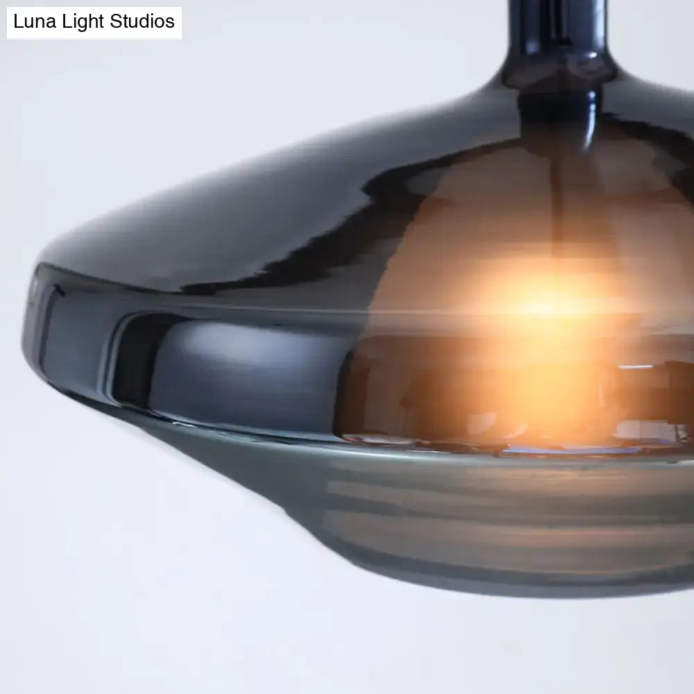 DecorBites™ modern dining room pendant light with dark amber glass shade and warm glow, featuring sleek fixture height and width