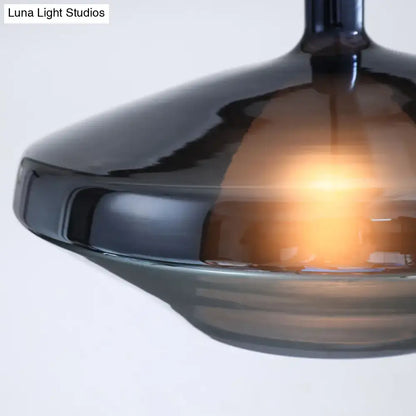 DecorBites™ modern dining room pendant light with dark amber glass shade and warm glow, featuring sleek fixture height and width