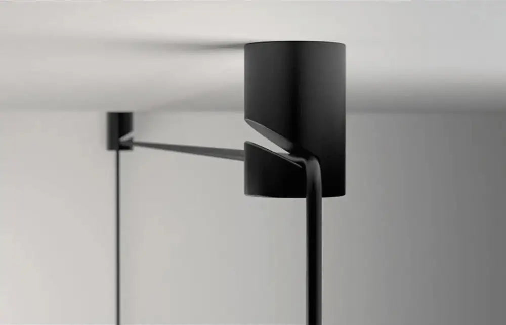 Black cylindrical ceiling-mounted pendant light with sleek minimalist design from DecorBites modern diy pendant light