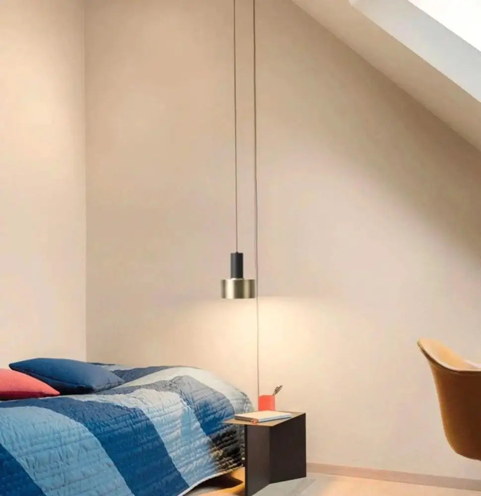 Minimalist DecorBites™ modern diy pendant light with sleek black cylindrical shade and brushed brass circular base suspended by thin cord