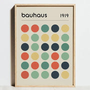 A minimalist framed decorbites modern geometric bauhaus canvas wall art with colorful circles and bauhaus logo