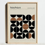 A minimalist framed canvas art poster featuring a geometric bauhaus exhibition pattern in black and tan on off-white background