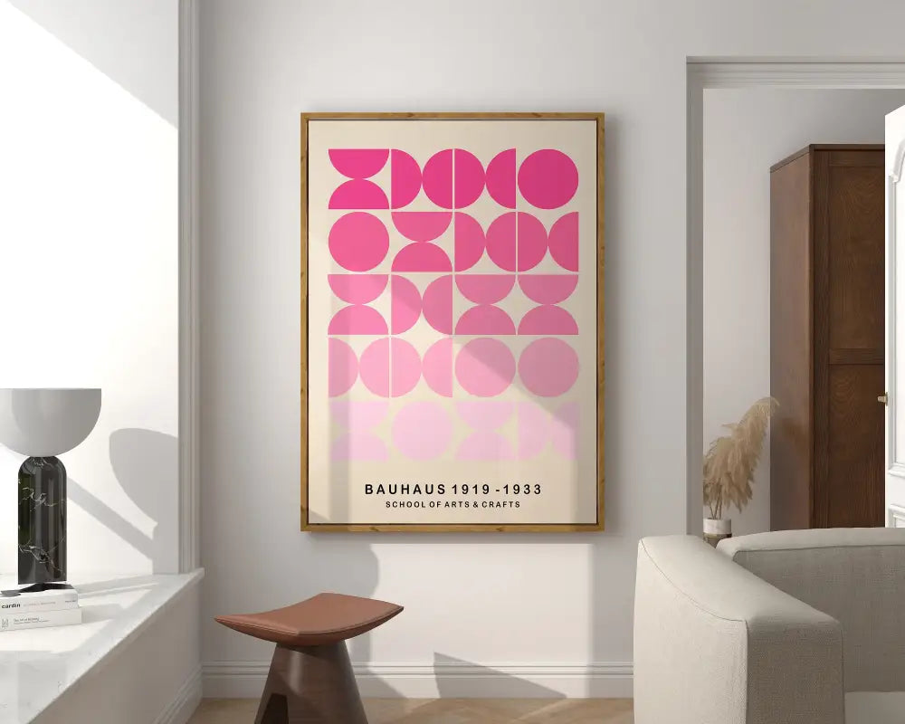 A framed bauhaus poster canvas print with pink geometric circles on off-white for modern geometric canvas decor