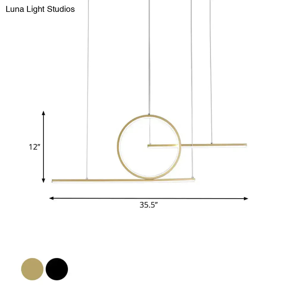 Modern minimalist decorbites™ led pendant light in black and gold with warm white illumination for kitchen lighting