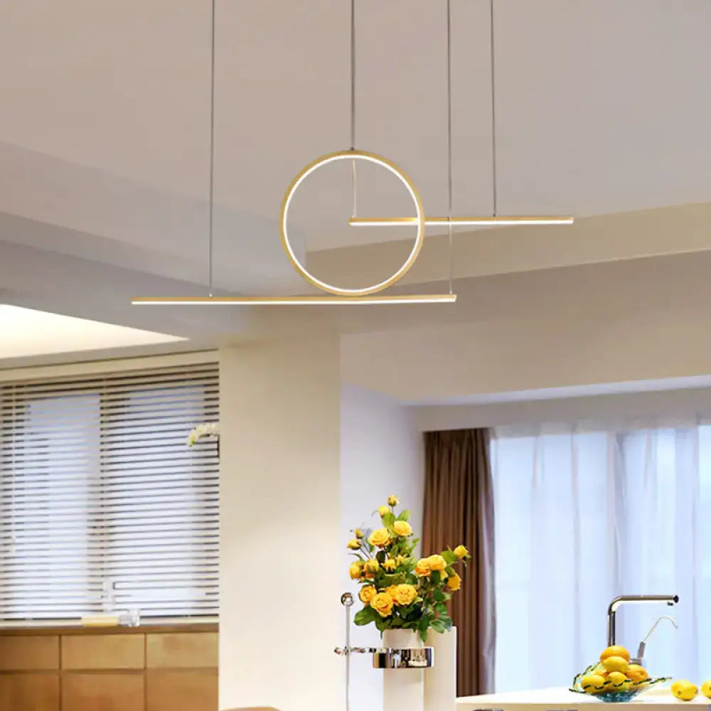 Modern minimalist decorbites led pendant light in black gold with warm white illumination for kitchen and island lighting