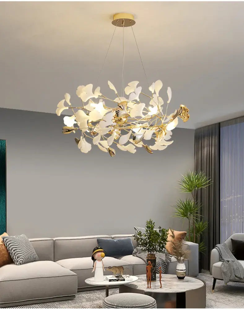 Modern ginkgo leaf led chandelier with golden metal frame and white leaf-shaped components for dining room lighting
