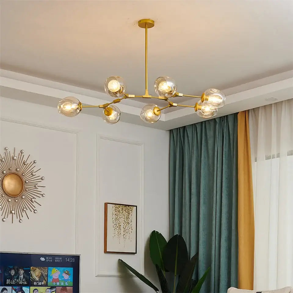 Gold-toned DecorBites™ modern glass ball led chandelier with six clear glass globe bulbs for home decor