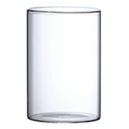 Clear cylindrical glass hydroponic vase with smooth transparent walls and rounded rim for wedding decor by decorbites