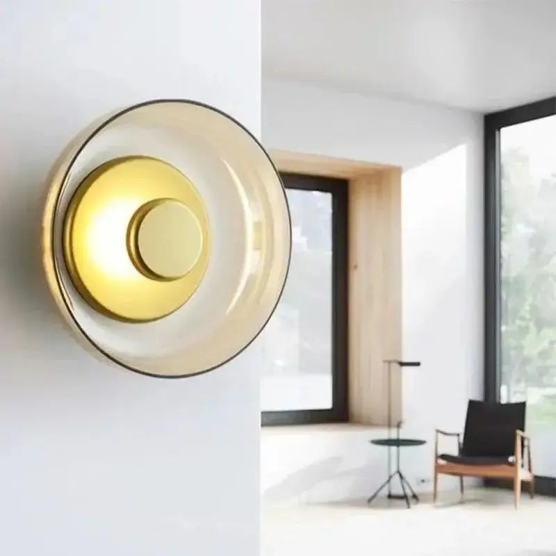 Decorbites modern glass led wall light with amber translucent glass shade and brass circular element wall light