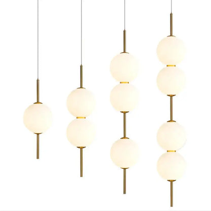 Decorbites™ modern glass pendant lighting with frosted glass spheres and brass accents for contemporary decor